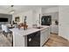 Modern kitchen with island, stainless steel appliances, and light grey cabinets at 4110 Jacoby Pl, Indianapolis, IN 46268