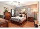 Bedroom with wooden furniture, gray walls, and ceiling fan at 5060 Dunewood Way, Avon, IN 46123