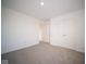 Empty bedroom featuring white closet doors and neutral carpeting at 5553 Tart Blvd, Indianapolis, IN 46239