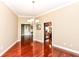 Formal dining room featuring hardwood floors and chandelier at 6471 Meridian Pkwy # Apt D, Indianapolis, IN 46220