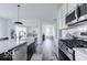 Modern kitchen with stainless steel appliances and white shaker cabinets at 6839 W Buck Stone Dr, McCordsville, IN 46055