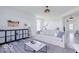 Living room with light walls, a sofa, and a view of kitchen at 6839 W Buck Stone Dr, McCordsville, IN 46055