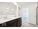 Double vanity bathroom with a shower and access to bedroom at 813 Stonehaven Dr, Indianapolis, IN 46239