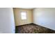 Small bedroom with one window and vintage carpeting at 8315 Woodall Dr, Indianapolis, IN 46268