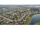 Aerial view of a neighborhood with houses and a lake at 845 Harvest Lake Dr, Brownsburg, IN 46112