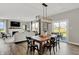 Farmhouse style dining room with wooden table and access to backyard at 8913 Lowell St, McCordsville, IN 46055