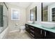 Modern bathroom with double vanity, glass shower, and mosaic tile accents at 10245 Briar Creek Ln, Carmel, IN 46033