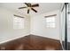 Bedroom with hardwood floors, shiplap accent wall, and ceiling fan at 10245 Briar Creek Ln, Carmel, IN 46033