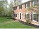 Brick home with black shutters and a landscaped yard at 10245 Briar Creek Ln, Carmel, IN 46033