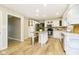 Bright kitchen featuring white cabinets and an island at 10245 Briar Creek Ln, Carmel, IN 46033