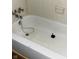 Clean bathroom with toilet and bathtub at 10447 Chris Dr, Indianapolis, IN 46229