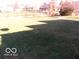 Large backyard with grassy area and privacy fence at 10604 Creekside Woods Dr, Indianapolis, IN 46239