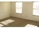 Bright bedroom with neutral carpeting and large windows at 10604 Creekside Woods Dr, Indianapolis, IN 46239