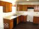 Kitchen with oak cabinets and laminate countertops at 10604 Creekside Woods Dr, Indianapolis, IN 46239