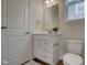 Small bathroom with white vanity and toilet at 14334 Beaument Blvd, Carmel, IN 46074