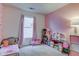 Bright bedroom with a playful floral wall at 1636 Austin Dr, Lebanon, IN 46052