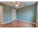 Simple bedroom with wood-look flooring and neutral walls at 1678 Farm Meadow Dr, Greenwood, IN 46143