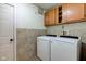 Laundry room with washer, dryer, and cabinets at 1678 Farm Meadow Dr, Greenwood, IN 46143