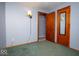 Small bedroom with wood door and green carpet at 1892 W 1000 S, Pendleton, IN 46064