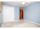 Light blue bedroom with white closet doors and carpet at 1892 W 1000 S, Pendleton, IN 46064