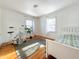 Bedroom with a single bed, exercise bike, and hardwood floors at 1922 E 5Th St, Anderson, IN 46012