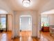 Bright entryway with hardwood floors and arched doorways leading to other rooms at 1922 E 5Th St, Anderson, IN 46012