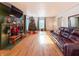 Living room with hardwood floors, fireplace, and Christmas tree at 1922 E 5Th St, Anderson, IN 46012