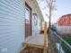 Newly built home with light blue siding, wooden deck, and backyard at 215 E Harrison St, Mooresville, IN 46158