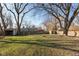 Large backyard with mature trees and sheds at 3060 S Shortridge Rd, Indianapolis, IN 46239