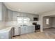 Gray shaker cabinets, white backsplash and stainless steel appliances at 3060 S Shortridge Rd, Indianapolis, IN 46239
