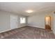 Living room featuring neutral walls, carpeting, and an archway at 3060 S Shortridge Rd, Indianapolis, IN 46239