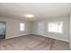 Spacious living room with neutral walls and carpeting at 3060 S Shortridge Rd, Indianapolis, IN 46239