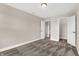 Simple bedroom with neutral walls, carpet, and access to closet and other rooms at 482 Chester Ln, Pittsboro, IN 46167