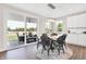 Bright breakfast nook features a round table, chairs, and sliding glass doors leading to a patio at 482 Chester Ln, Pittsboro, IN 46167