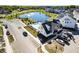 Aerial view of community pool, clubhouse, and pond at 543 Gilder Dr, Carmel, IN 46032