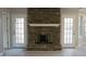 Brick fireplace flanked by French doors at 6845 Arjay Dr, Indianapolis, IN 46217