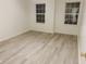 Bright bedroom featuring vinyl flooring and large windows at 6936 W Briarwood Blvd, New Palestine, IN 46163