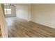 Spacious living room featuring hardwood floors and a large window at 6936 W Briarwood Blvd, New Palestine, IN 46163