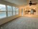 Open living room with view into kitchen and backyard at 6936 W Briarwood Blvd, New Palestine, IN 46163