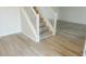 Staircase with white railing and light gray wood-look flooring at 6936 W Briarwood Blvd, New Palestine, IN 46163