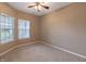 Bright bedroom featuring neutral walls and carpet at 7515 Sunset Ridge Pkwy, Indianapolis, IN 46259