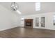 Spacious living room with vaulted ceiling, fireplace, and skylights at 7806 Camberwood Dr, Indianapolis, IN 46268