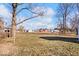 Large backyard with open space and mature trees at 807 Alden Dr, Fortville, IN 46040