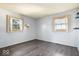 Spacious bedroom with light gray walls and gray vinyl plank flooring at 807 Alden Dr, Fortville, IN 46040
