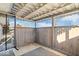 Covered porch with wood walls, string lights, and a partially enclosed design at 807 Alden Dr, Fortville, IN 46040
