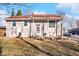 Ranch home with red roof, covered porch, and landscaped yard at 807 Alden Dr, Fortville, IN 46040