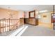 Open living space with loft and wooden railing at 807 Alden Dr, Fortville, IN 46040
