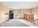Spacious living area with large window and carpeted floor at 807 Alden Dr, Fortville, IN 46040