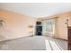 Living room with large window and carpeted floor at 807 Alden Dr, Fortville, IN 46040