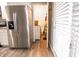 View into laundry room from kitchen, with washer, dryer, and storage at 8435 Buckingham Dr, Columbus, IN 47201